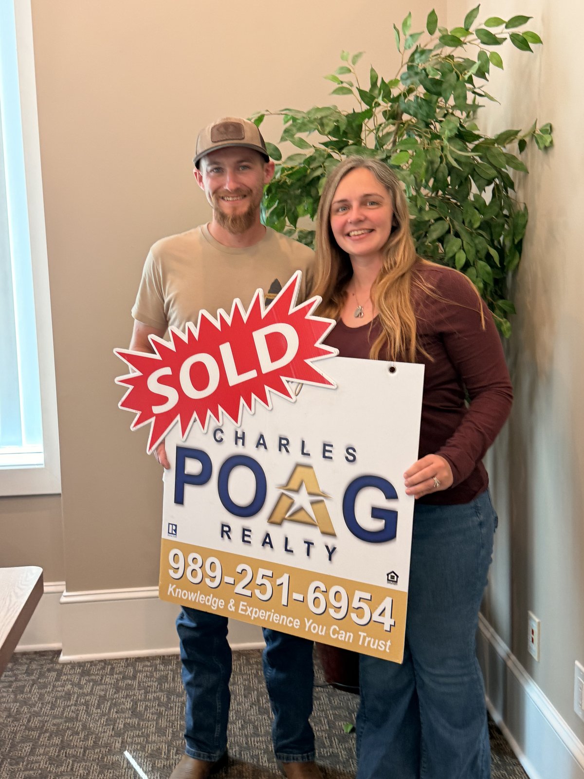 Charles Poag with clients at closing