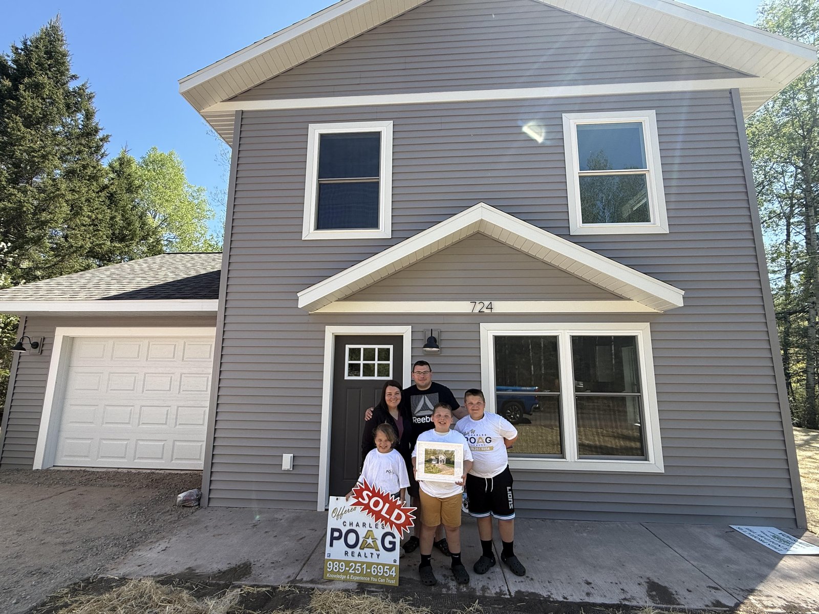 Charles Poag with clients at closing